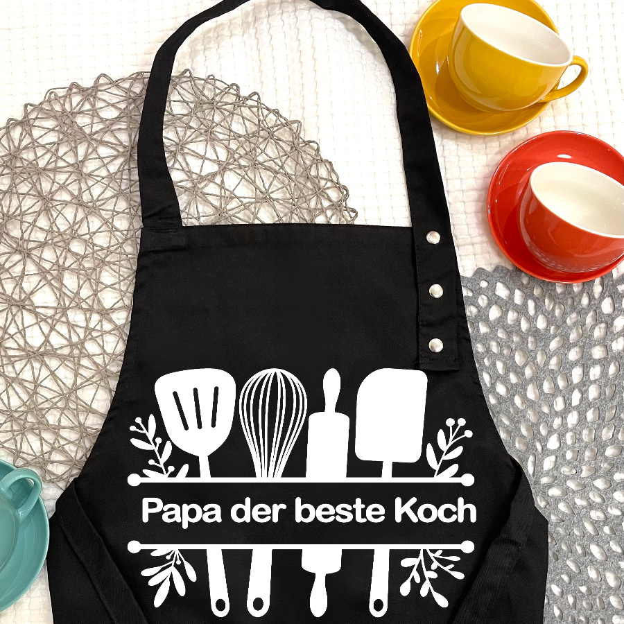 Kochschürze personalisieren und bedrucken Schweiz-Kochschürze bedruckt auf dem Tisch