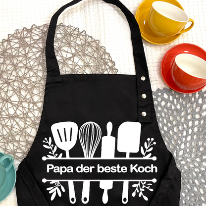 Kochschürze personalisieren und bedrucken Schweiz-Kochschürze bedruckt auf dem Tisch